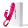 Pink thrusting rabbit vibrator with flexible rabbit ears beside product box